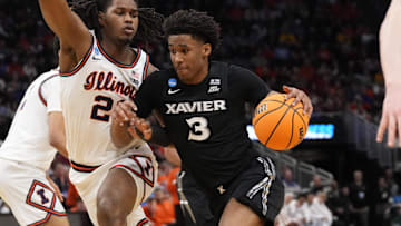 Mar 21, 2025; Milwaukee, WI, USA: Xavier Musketeers guard Dailyn Swain (3) drives to the hoop past Illinois Fighting Illini guard Ty Rodgers (20) during the second half at Fiserv Forum. Mandatory Credit: Jeff Hanisch-Imagn Images