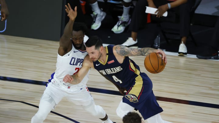 Aug 1, 2020; Lake Buena Vista, USA; JJ Redick #4 of the New Orleans Pelicans drives against Patrick Beverley #21 of the LA Clippers at HP Field House at ESPN Wide World Of Sports Complex on August 01, 2020 in Lake Buena Vista, Florida. Mandatory Credit: Kevin C. Cox/Pool Photo via USA TODAY Sports