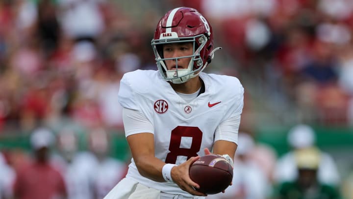 Sep 16, 2023; Tampa, Florida, USA;  Alabama Crimson Tide quarterback Tyler Buchner (8) looks to hand off  against the South Florida Bulls in the first quarter at Raymond James Stadium. Mandatory Credit: Nathan Ray Seebeck-USA TODAY Sports