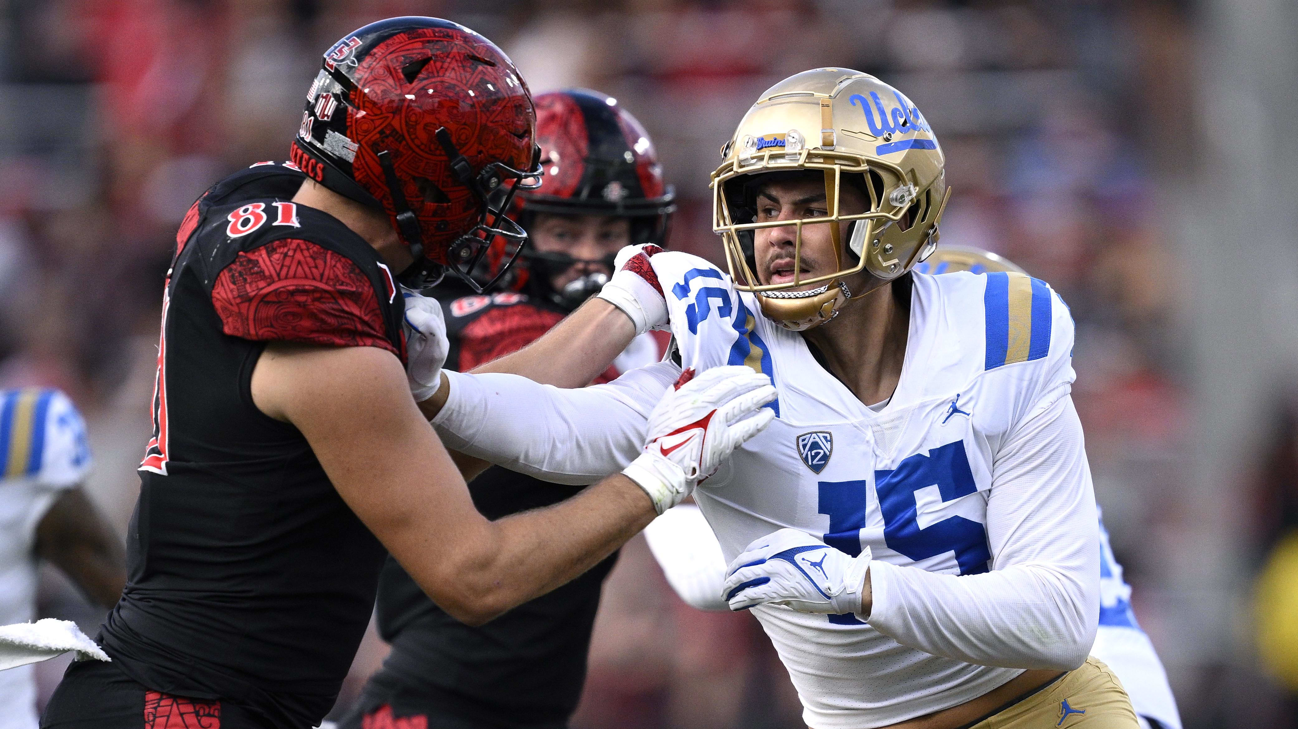 UCLA defensie end Laiatu Latu rushes the passer