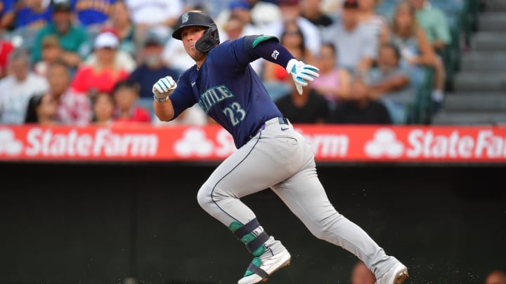 Jul 11, 2024; Anaheim, California, USA; Seattle Mariners first baseman Ty France (23) runs after hitting into a fielder choice against the Los Angeles Angels during the first inning at Angel Stadium. 