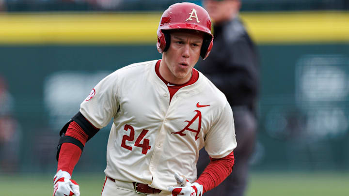 Charles Davalan runs the bases for the Arkansas Razorbacks.