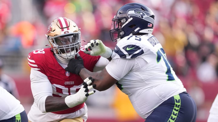 Dec 10, 2023; Santa Clara, California, USA; Seattle Seahawks guard Anthony Bradford (75) blocks San Francisco 49ers defensive tackle Javon Kinlaw (left) during the third quarter at Levi's Stadium. Mandatory Credit: Darren Yamashita-USA TODAY Sports