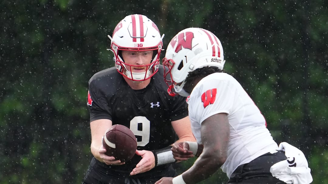 Wisconsin quarterback Billy Edwards Jr. (9) gives a handoff to running back Darrion Dupree (6) during football practice, July 30, 2025, at Ralph E. Davis Pioneer Stadium in Platteville, Wisconsin.
