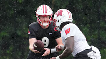 Wisconsin quarterback Billy Edwards Jr. (9) gives a handoff to running back Darrion Dupree (6) during football practice, July 30, 2025, at Ralph E. Davis Pioneer Stadium in Platteville, Wisconsin.