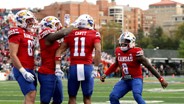 Kansas football celebrates a touchdown pass from Jalon Daniels (6) to Bryson Canty (11)