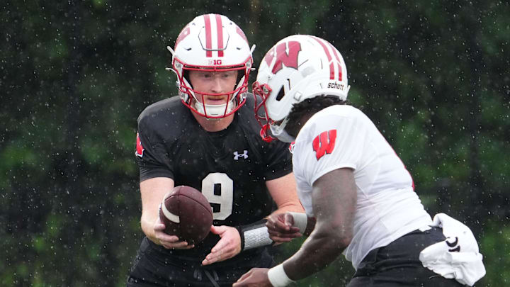 Wisconsin quarterback Billy Edwards Jr. (9) gives a handoff to running back Darrion Dupree (6) during football practice Wednesday, July 30, 2025, at Ralph E. Davis Pioneer Stadium in Platteville, Wisconsin. Wisconsin quarterback Billy Edwards Jr. (9) gives a handoff to running back Darrion Dupree (6) during football practice Wednesday, July 30, 2025, at Ralph E. Davis Pioneer Stadium in Platteville, Wisconsin.