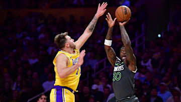 Apr 30, 2025; Los Angeles, California, USA; Minnesota Timberwolves forward Julius Randle (30) shoots against Los Angeles Lakers guard Luka Doncic (77) during the second half in game five of first round for the 2025 NBA Playoffs at Crypto.com Arena. Mandatory Credit: Gary A. Vasquez-Imagn Images