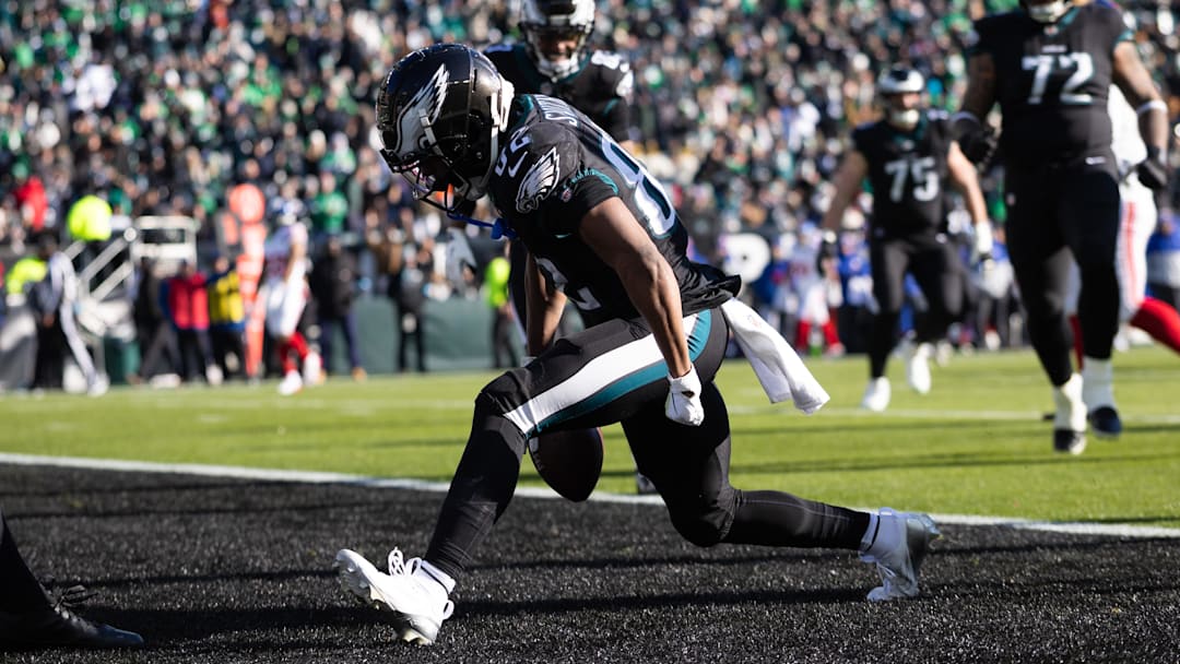Jan 5, 2025; Philadelphia, Pennsylvania, USA; Philadelphia Eagles wide receiver Ainias Smith (82) reacts after his touchdown catch against the New York Giants during the first quarter at Lincoln Financial Field. Mandatory Credit: Bill Streicher-Imagn Images