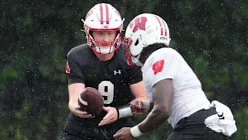 Wisconsin quarterback Billy Edwards Jr. (9) gives a handoff to running back Darrion Dupree (6) during football practice, July 30, 2025, at Ralph E. Davis Pioneer Stadium in Platteville, Wisconsin.