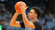 Oct 4, 2025; Charlotte, NC, USA; North Carolina Tar Heels guard Luka Bogavac (44) shoots in the second half at Dean E. Smith Center. Mandatory Credit: Bob Donnan-Imagn Images