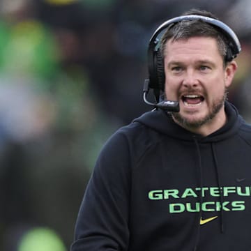 Oct 25, 2025; Eugene, Oregon, USA; Oregon Ducks head coach Dan Lanning instructs players during the first half against the Wisconsin Badgers at Autzen Stadium. Mandatory Credit: Troy Wayrynen-Imagn Images