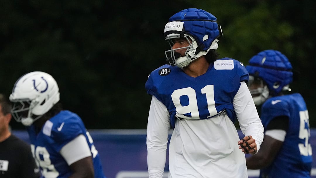 Indianapolis Colts defensive end JT Tuimoloau (91) walks up the field Thursday, July 31, 2025, during Colts Training Camp at Grand Park in Westfield.