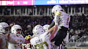 Nov 15, 2025; Chestnut Hill, Massachusetts, USA; Georgia Tech Yellow Jackets running back Jamal Haynes (1) celebrates his touchdown with his teammates during the second half against the Boston College Eagles at Alumni Stadium. Mandatory Credit: Bob DeChiara-Imagn Images