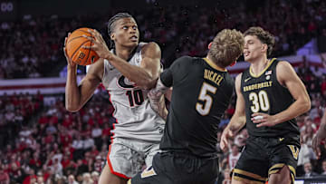 Georgia Bulldogs forward RJ Godfrey (10) is called for an offensive foul after running into Vanderbilt Commodores guard Tyler Nickel (5) during the first half at Stegeman Coliseum.