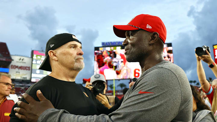 Sep 8, 2024; Tampa, Florida, USA; Washington Commanders head coach Dan Quinn and Tampa Bay Buccaneers head coach Todd Bowles greets after the game at Raymond James Stadium. Mandatory Credit: Kim Klement Neitzel-Imagn Images