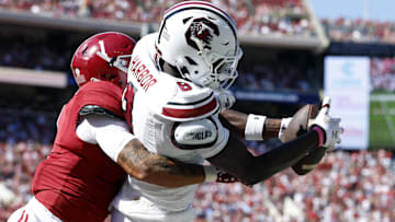 Oct 12, 2024; Tuscaloosa, Alabama, USA;  South Carolina Gamecocks wide receiver Nyck Harbor (8) catches a pass for a touchdown as Alabama Crimson Tide defensive back Domani Jackson (1) defends during the second half at Bryant-Denny Stadium. Mandatory Credit: Butch Dill-Imagn Images