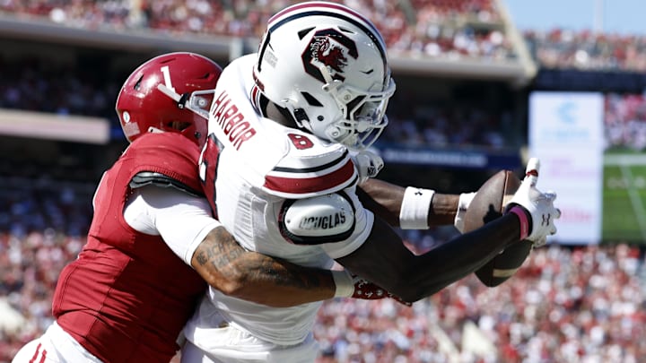 Oct 12, 2024; Tuscaloosa, Alabama, USA;  South Carolina Gamecocks wide receiver Nyck Harbor (8) catches a pass for a touchdown as Alabama Crimson Tide defensive back Domani Jackson (1) defends during the second half at Bryant-Denny Stadium. Mandatory Credit: Butch Dill-Imagn Images