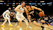 Feb 6, 2024; Phoenix, Arizona, USA; Phoenix Suns guard Devin Booker (1) drives to the basket against Milwaukee Bucks guard Pat Connaughton (24) during the third quarter at Footprint Center.