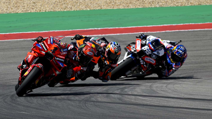 Apr 13, 2024; Austin, TX, USA; Francesco Bagnaia (1) of Italy and Ducati Lenovo Team and Brad Binder (33) of South Africa and Red Bull KTM Factory Racing and Jorge Martin (89) of Spain and Prima Pramac Racing during the Americas Grand Prix sprint race at Circuit of The Americas. Mandatory Credit: Jerome Miron-USA TODAY Sports