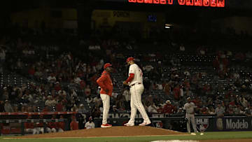 Jun 9, 2025; Anaheim, California, USA;   Los Angeles Angels manager Ron Washington (37) brings in relief pitcher Kenley Jansen (74) to close out the ninth inning against the Athletics at Angel Stadium. Mandatory Credit: Jayne Kamin-Oncea-Imagn Images