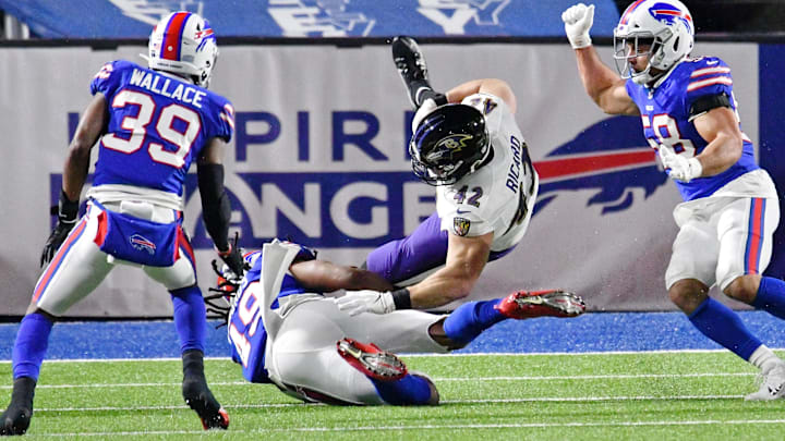 Jan 16, 2021; Orchard Park, New York, USA; Buffalo Bills middle linebacker Tremaine Edmunds (49) upends Baltimore Ravens fullback Patrick Ricard (42) during the first half of an AFC Divisional Round playoff game at Bills Stadium. Mandatory Credit: Mark Konezny-Imagn Images Jan 16, 2021; Orchard Park, New York, USA; Buffalo Bills middle linebacker Tremaine Edmunds (49) upends Baltimore Ravens fullback Patrick Ricard (42) during the first half of an AFC Divisional Round playoff game at Bills Stadium. Mandatory Credit: Mark Konezny-Imagn Images