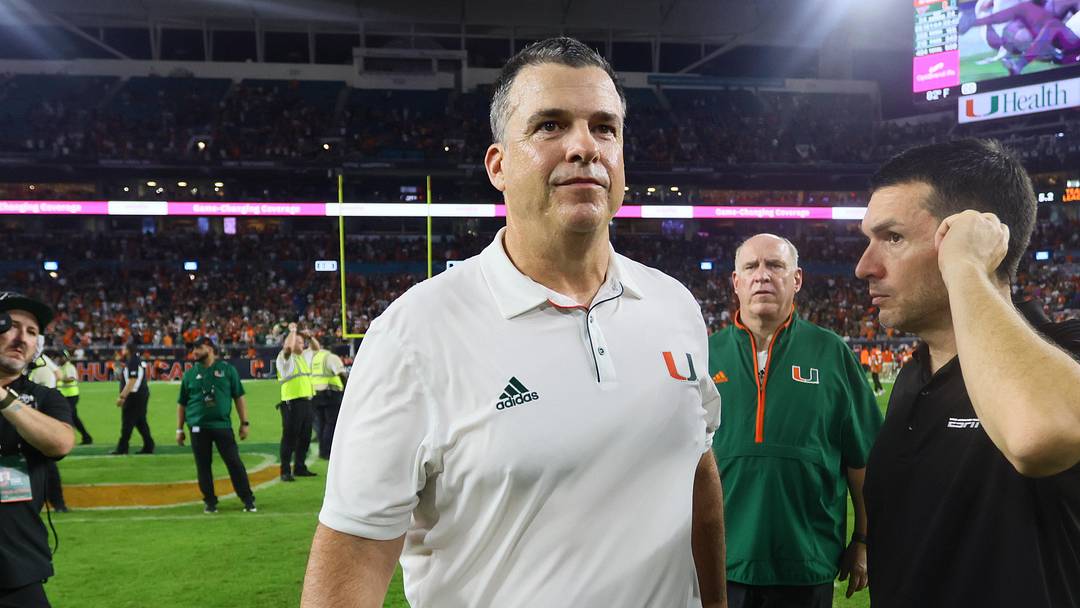 Sep 27, 2024; Miami Gardens, Florida, USA; Miami Hurricanes head coach Mario Cristobal walks on the field against the Virginia Tech Hokies as game officials review the last play of the game at Hard Rock Stadium. Mandatory Credit: Sam Navarro-Imagn Images