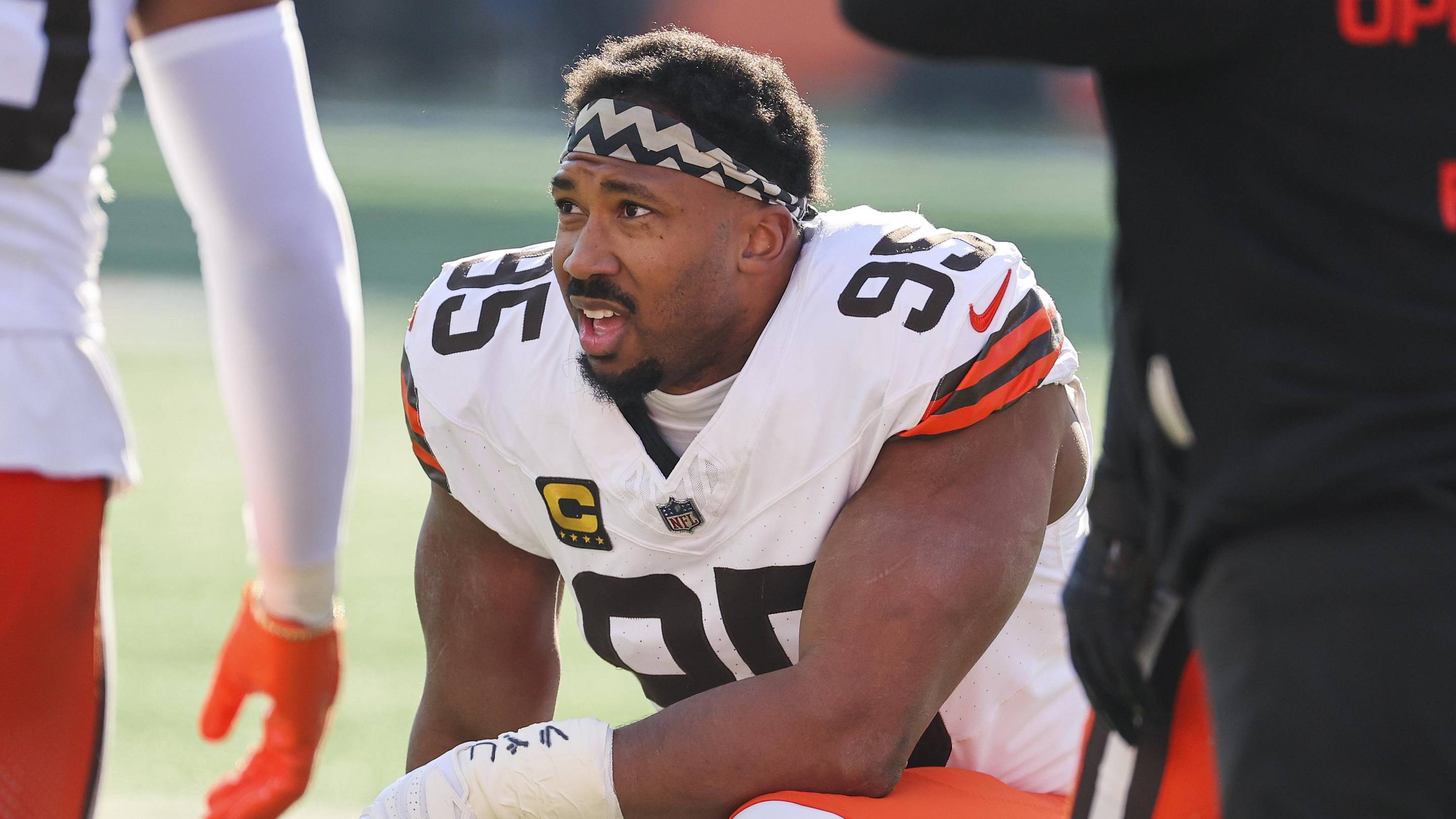 Jan 4, 2026; Cincinnati, Ohio, USA; Cleveland Browns defensive end Myles Garrett (95) kneels on the field during a first half timeout against the Cincinnati Bengals at Paycor Stadium. Mandatory Credit: Joseph Maiorana-Imagn Images