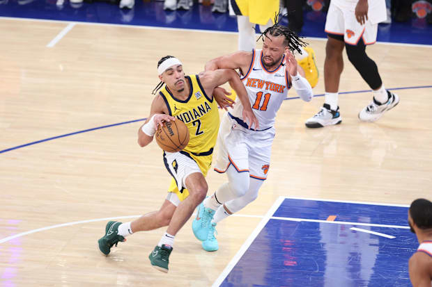 Indiana Pacers guard Andrew Nembhard (2) controls the ball against New York Knicks guard Jalen Brunson (11). 