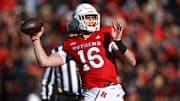 Nov 9, 2024; Piscataway, New Jersey, USA; Rutgers Scarlet Knights quarterback Athan Kaliakmanis (16) throws a touchdown pass during the first half against the Minnesota Golden Gophers at SHI Stadium. Mandatory Credit: Vincent Carchietta-Imagn Images