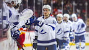 Dec 12, 2024; Calgary, Alberta, CAN; Tampa Bay Lightning center Jake Guentzel (59) celebrates his goal with teammates against the Calgary Flames during the third period at Scotiabank Saddledome. Mandatory Credit: Sergei Belski-Imagn Images