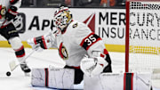 Dec 1, 2024; Anaheim, California, USA;  Ottawa Senators goaltender Linus Ullmark (35) deflects a shot against the Anaheim Ducks during the second period at Honda Center. Mandatory Credit: Alex Gallardo-Imagn Images