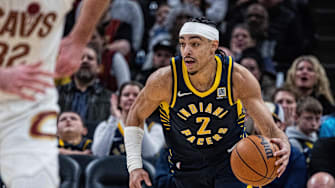 Jan 14, 2025; Indianapolis, Indiana, USA;  Indiana Pacers guard Andrew Nembhard (2) dribbles the ball in the second half against the Cleveland Cavaliers at Gainbridge Fieldhouse. Mandatory Credit: Trevor Ruszkowski-Imagn Images