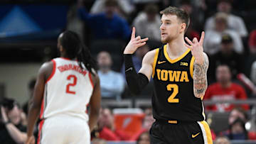 Mar 12, 2025; Indianapolis, IN, USA; Iowa Hawkeyes guard Brock Harding (2) celebrates after making a three-point basket during the first half against the Ohio State Buckeyes at Gainbridge Fieldhouse. Mandatory Credit: Robert Goddin-Imagn Images