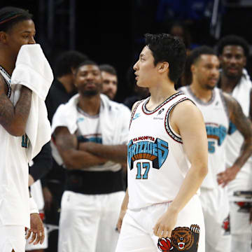 Oct 26, 2024; Memphis, Tennessee, USA; Memphis Grizzlies guard Ja Morant (12) talks to guard Yuki Kawamura (17) during the second half against the Orlando Magic at FedExForum. Mandatory Credit: Petre Thomas-Imagn Images