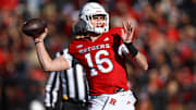 Nov 9, 2024; Piscataway, New Jersey, USA; Rutgers Scarlet Knights quarterback Athan Kaliakmanis (16) throws a touchdown pass during the first half against the Minnesota Golden Gophers at SHI Stadium. Mandatory Credit: Vincent Carchietta-Imagn Images