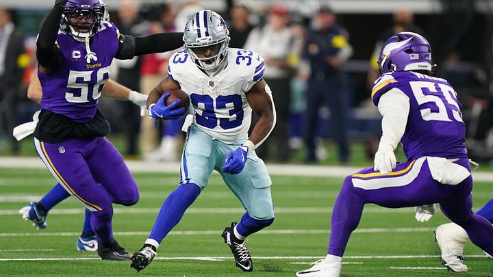 Dec 14, 2025; Arlington, Texas, USA; Dallas Cowboys running back Javonte Williams (33) runs against Minnesota Vikings linebacker Jonathan Greenard (58) and linebacker Eric Wilson (55) during the second half at AT&T Stadium. Mandatory Credit: Raymond Carlin III-Imagn Images