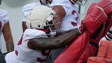 July 30, 2025; Tuscaloosa, AL, USA; defensive lineman Jeremiah Beaman hits the sled during the first practice session of the preseason for the Alabama Crimson Tide.
