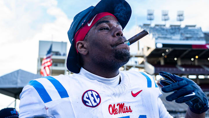 Ole Miss defensive lineman Zxavian Harris (51) smokes a cigar after a college football game between Mississippi State and Ole Miss at Davis Wade Stadium in Starkville, Miss., on Friday, Nov. 28, 2025. Ole Miss defeated Mississippi State 38-19 in the Egg Bowl.