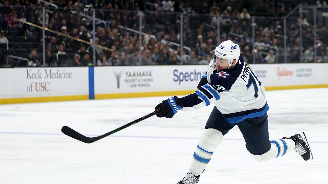 Nov 4, 2025; Los Angeles, California, USA;  Winnipeg Jets left wing Tanner Pearson (70) takes a slapshot during the third period against the Los Angeles Kings at Crypto.com Arena. Mandatory Credit: Kiyoshi Mio-Imagn Images