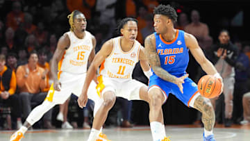 Florida's Alijah Martin (15) is defended by Tennessee's Jordan Gainey (11) during an NCAA college basketball game between Tennessee and Florida in Knoxville, Tenn., Saturday, Feb. 1, 2025.