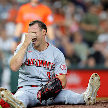 May 9, 2025; Houston, Texas, USA; Cincinnati Reds pitcher Brent Suter (31) sits on the mound after sustaining a slight injury against the Houston Astros during the eighth inning at Daikin Park. Mandatory Credit: Erik Williams-Imagn Images