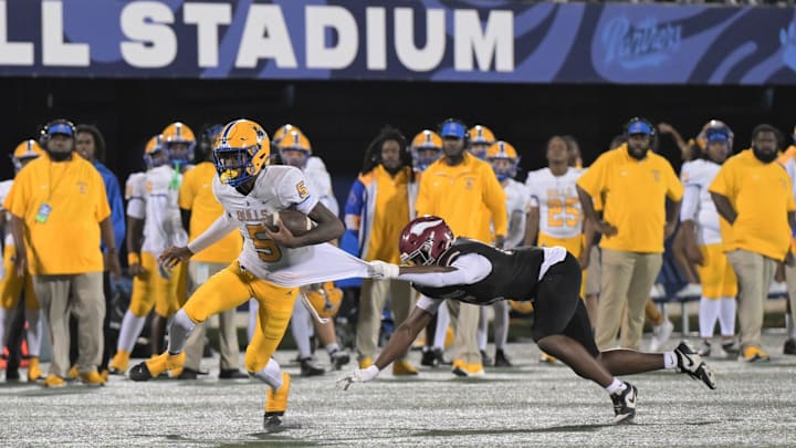 Miami Northwestern's Calvin Russell Jr. is tough to bring down even if you get a hold of more than the shirt tail.