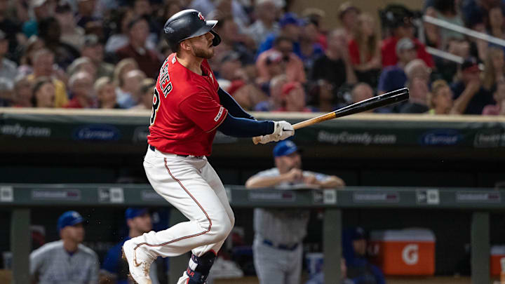 Sep 19, 2019; Minneapolis, MN, USA; Minnesota Twins catcher Mitch Garver (18) hits a solo home run during the fifth inning at Target Field. Mandatory Credit: Jordan Johnson-Imagn Images