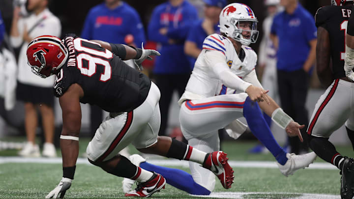 Oct 13, 2025; Atlanta, Georgia, USA; Buffalo Bills quarterback Josh Allen (17) is pressured by. Atlanta Falcons defensive tackle David Onyemata (90) during the second half of a game at Mercedes-Benz Stadium. Mandatory Credit: Brett Davis-Imagn Images