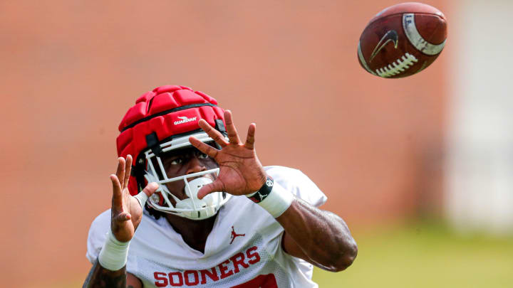 Lewis Carter (20) runs drills during an OU football practice in Norman, Okla., on Monday, Aug. 7, 2023.