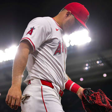 Apr 23, 2024; Anaheim, California, USA; Los Angeles Angels center fielder Mike Trout (27) returns to the dugout following the sixth inning against the Baltimore Orioles  at Angel Stadium. Mandatory Credit: Gary A. Vasquez-USA TODAY Sports