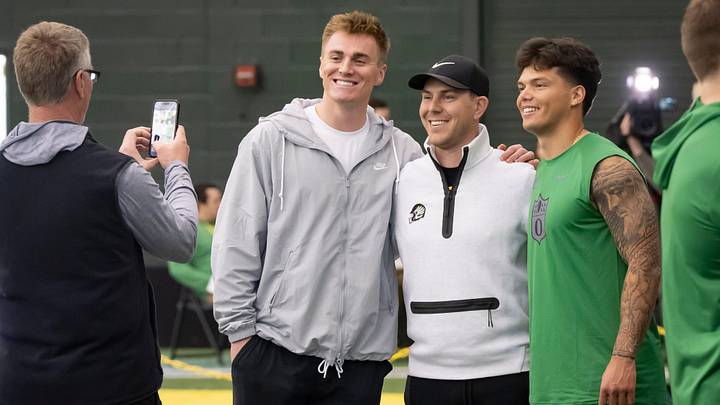 Denver Broncos quarterback Bo Nix, a former Oregon quarterback, left, and Oregon quarterback Dillon Gabriel, right, take a picture with Oregon offensive coordinator and quarterbacks coach Will Stein during the Oregon football’s Pro Day Tuesday, March 18, 2025, at the Moshofsky Center in Eugene, Ore.