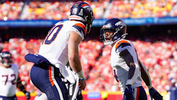 Nov 10, 2024; Kansas City, Missouri, USA; Denver Broncos wide receiver Courtland Sutton (14) celebrates with quarterback Bo Nix (10) after scoring against the Kansas City Chiefs during the first half at GEHA Field at Arrowhead Stadium.