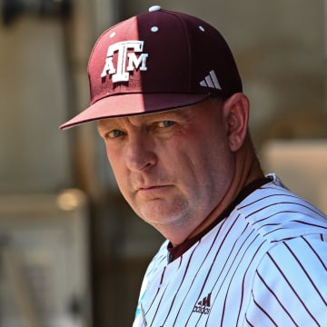 Jun 8, 2024; College Station, TX, USA; Texas A&M head coach Jim Schlossnagle looks on from the dugout prior to the game against the Oregon at Olsen Field, Blue Bell Park.